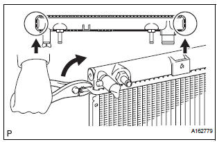 Install lower radiator tank