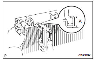Install lower radiator tank