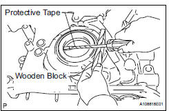 REMOVE TIMING CHAIN CASE OIL SEAL