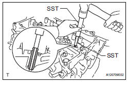 REMOVE EXHAUST VALVE GUIDE BUSH