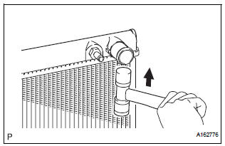 REMOVE LOWER RADIATOR TANK