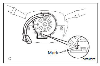 Always place a removed or new steering pad surface upward as shown in the illustration.