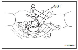 REMOVE TRANSAXLE HOUSING OIL SEAL