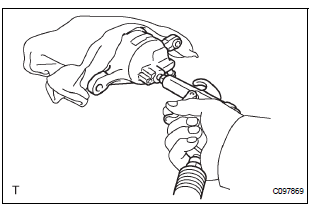 REMOVE FRONT DISC BRAKE PISTON