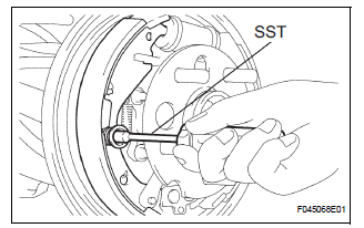 INSTALL FRONT BRAKE SHOE