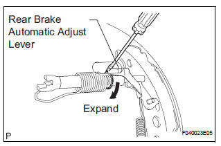 ADJUST REAR DRUM BRAKE SHOE CLEARANCE